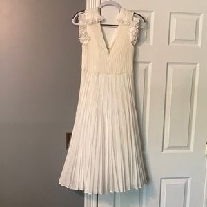 Halston white ruffled midi dress.